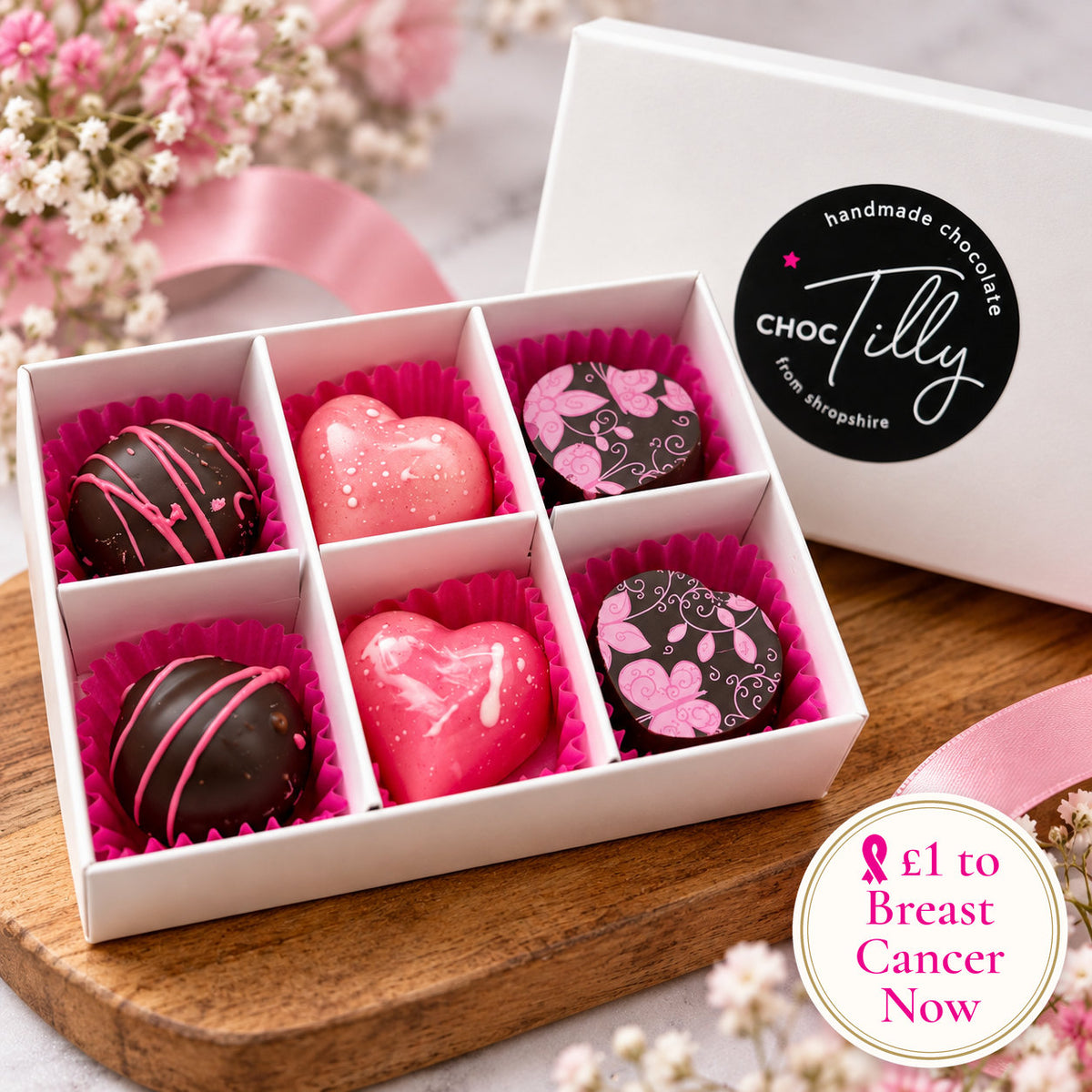 The Pink Collection by ChocTilly: six handmade chocolate bonbons in a white gift box with pink ribbon, with a seal reading £1 to Breast Cancer Now