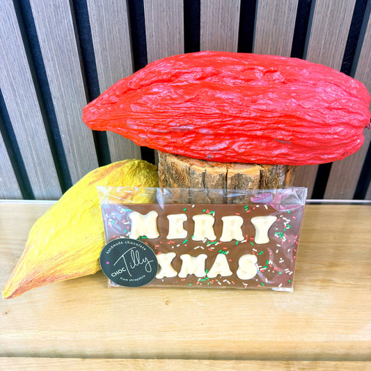ChocTilly Merry Xmas chocolate bar with white chocolate lettering and festive sprinkles